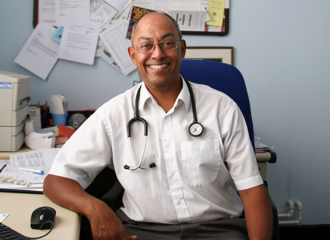 smiling male doctor in a white shirt